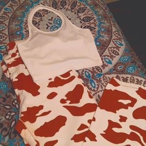 Brown and white cow print jeans and white halter top